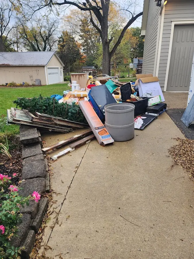 Dumpster being loaded with debris for Commercial Dumpster Rental in Buffalo